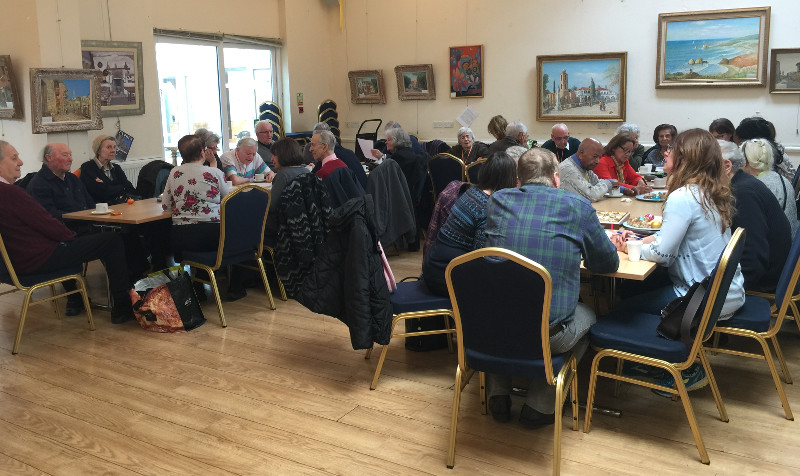 Members of Dementia Club UK concentrating on the Chocolate Quiz