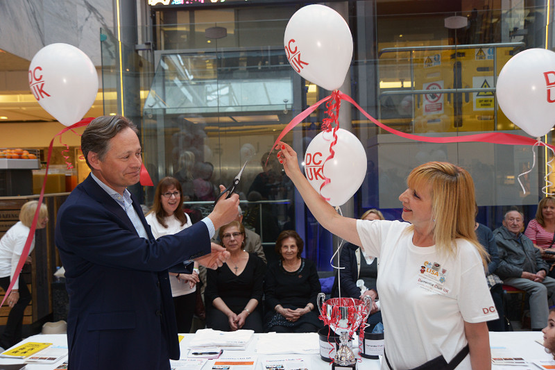 Matthew Offord MP cutting ribbon to officially launch Dementia Club UK