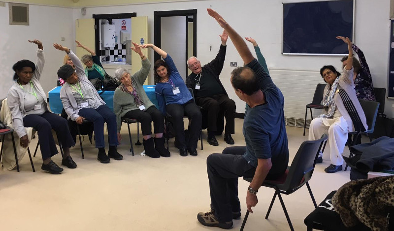 Richard leading the Dementia Club UK members through some gentle stretching exercises