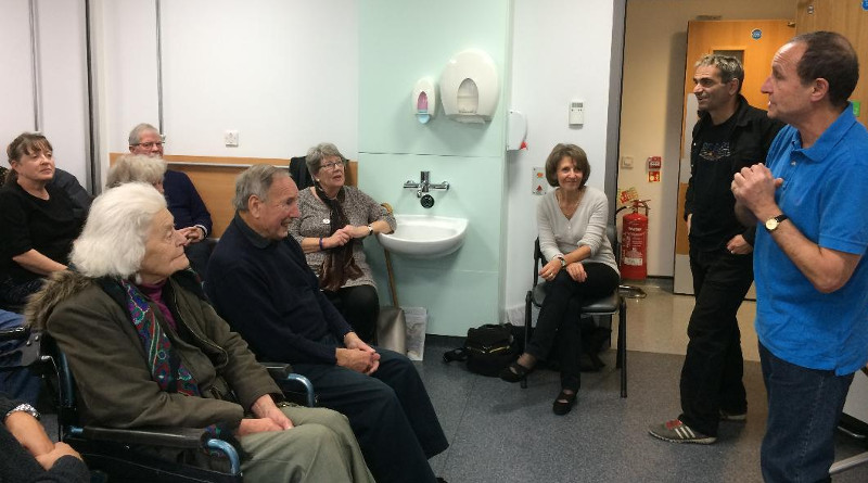 Chair exercises with Richard, watched by Andrea Hutter (sitting near the door).