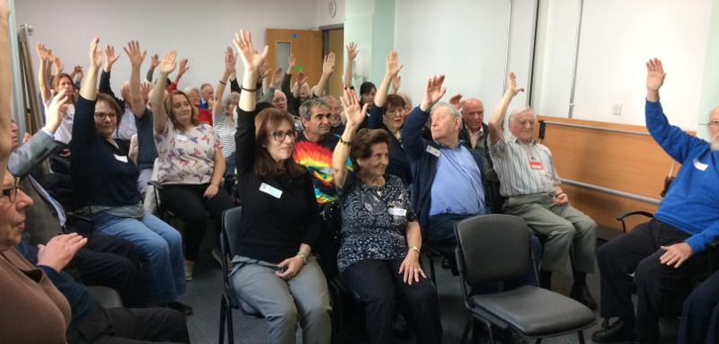 Dementia Club UK members doing chair yoga exercises taken by Richard