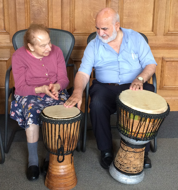 Members of Dementia Club UK learning to play African Drums