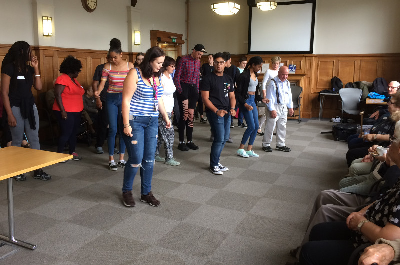 NCS students showing some of the members of Dementia Club UK how to line dance