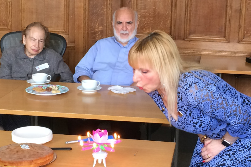 Lisa blowing out the candles on her Birthday Cake