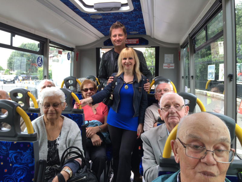 George Clarke from Channel 4 TV Show Amazing Spaces with the members from Dementia Club UK at Kew Gardens on one of the BCT buses