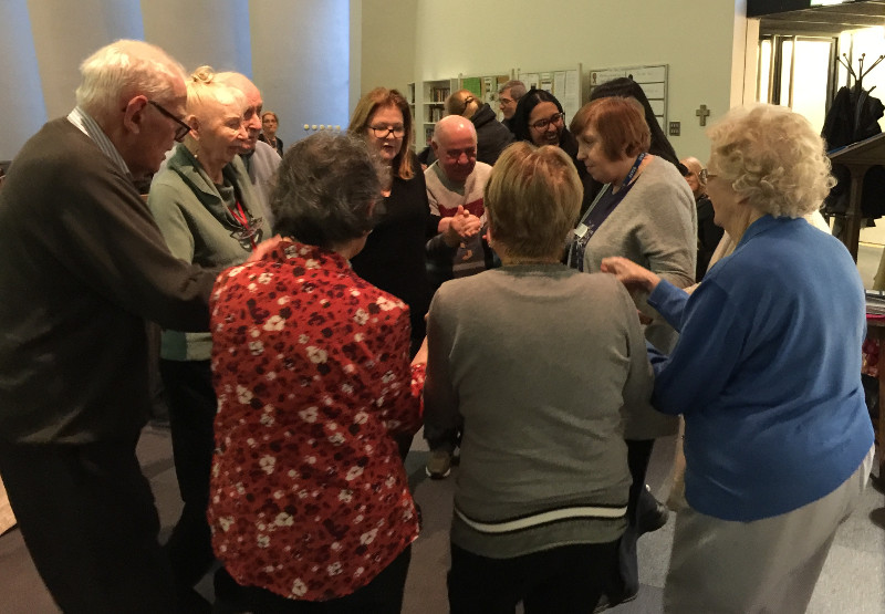 Members dancing the Hokey Pokey