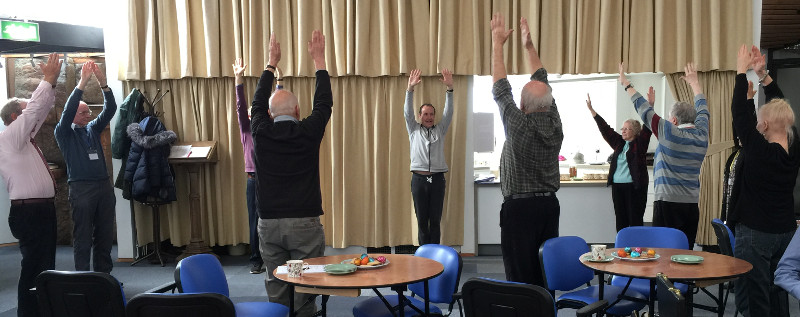 Richard instructing chair yoga