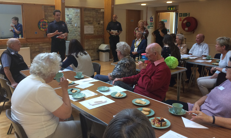 Commander Gary Shinn and his crew explaining fire safety to the members of Dementia Club UK