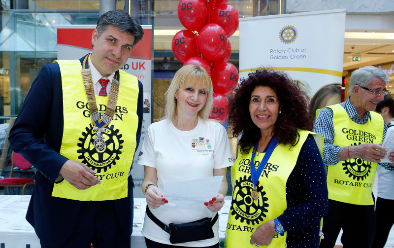 Volunteers and partners at the Rotary Club of Golders Green, President Martin Schramm, Founder and Chairman of Dementia Club UK Lisa Rutter, Valerie Chodosh & Geoff in the background