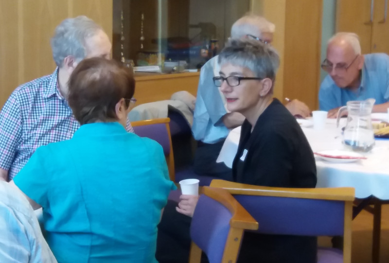 Rabbi Shulamit Ambalu talking with some members