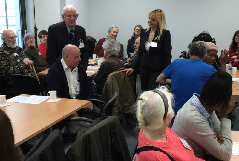 Laurie standing, recounting his Christmas to the members of Dementia Club UK