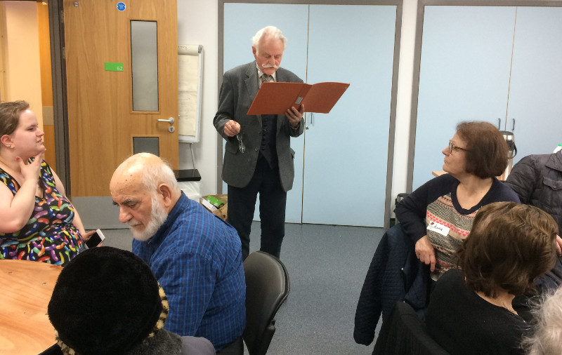 Cllr John Hart reading some French poetry