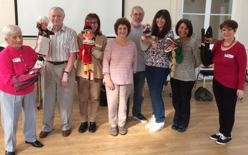 Ross and Michael Berg centre, with club members holding the various puppets 