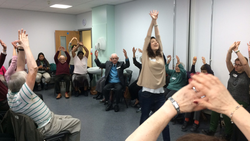 Members exercise with Tija at Dementia Club UK